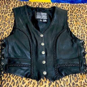 Biker Lady Vest. Black Leather. Braiding, laces at sides, coin shape snaps